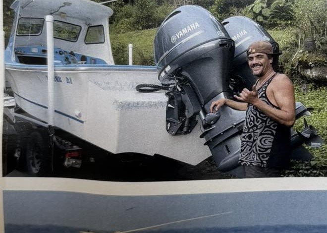 Earl Hind with his vessel Makalapuaonalani and its twin outboard motors